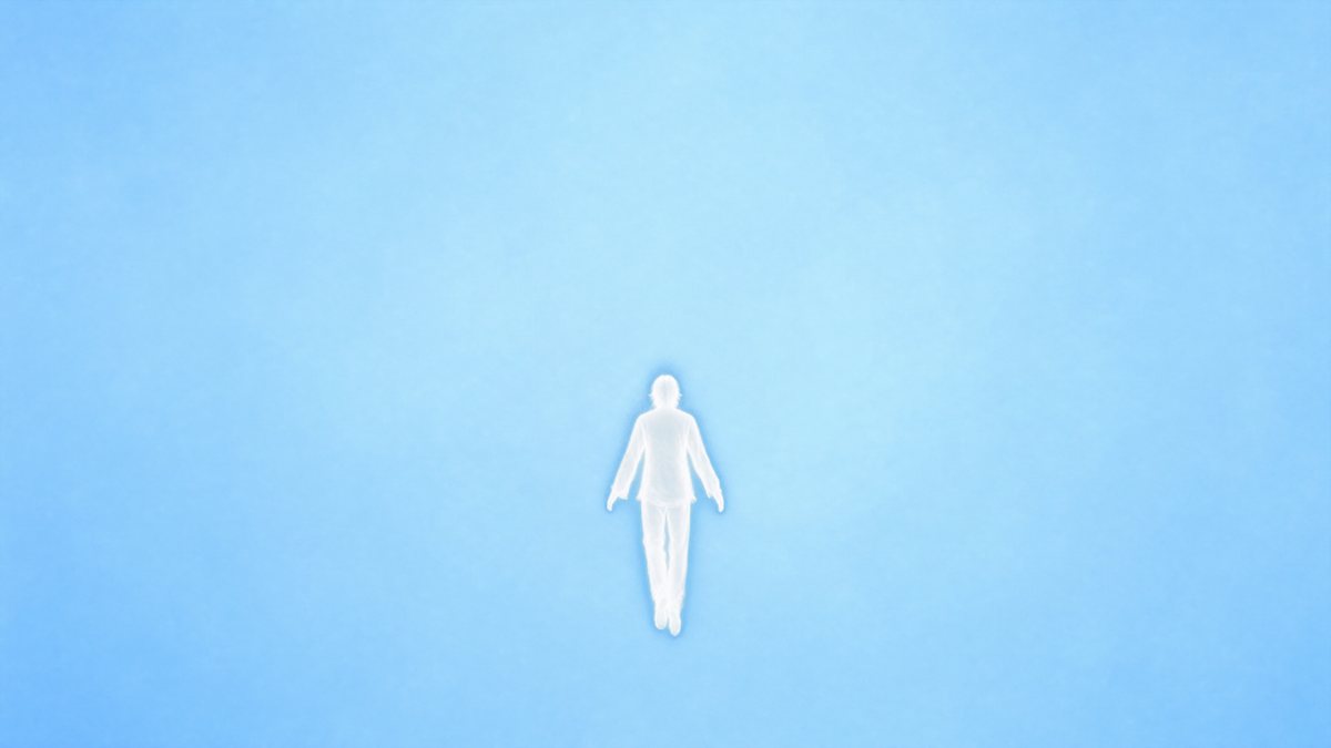He floats in soft ice-blue light